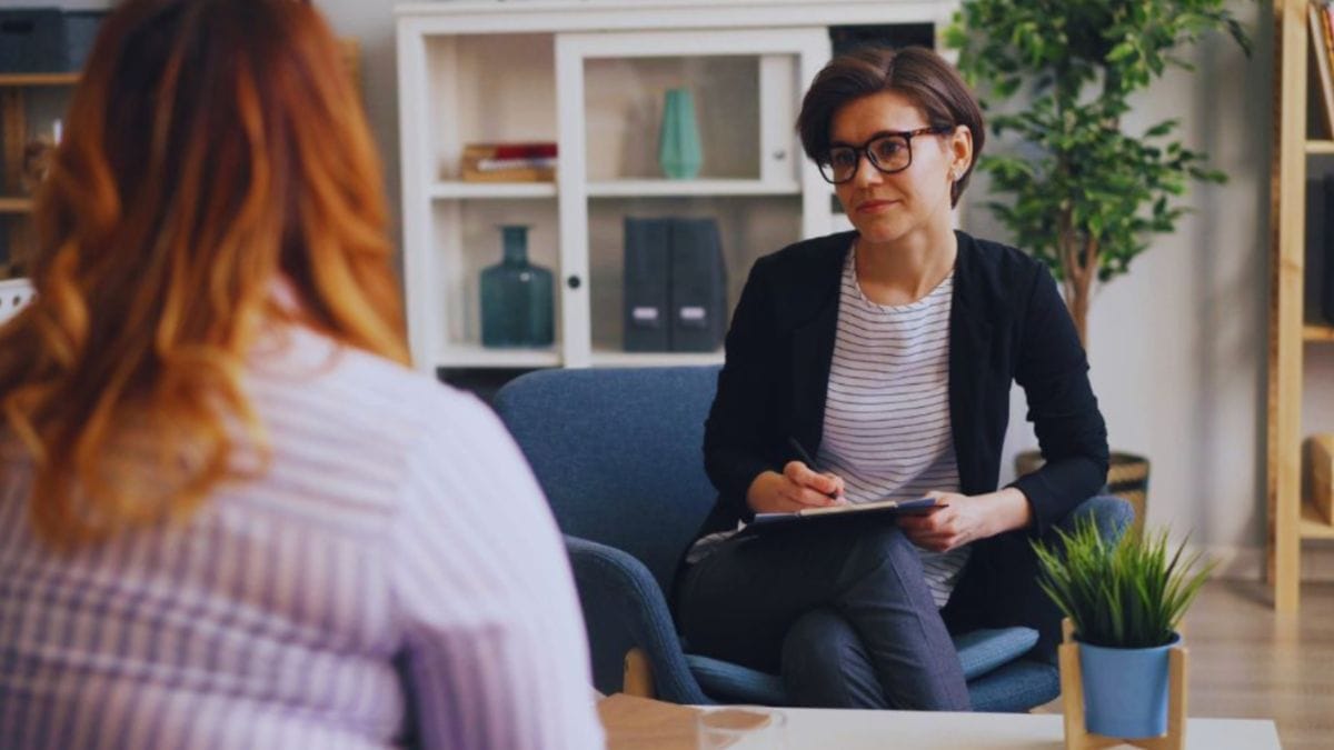 Intuitive Consulting in Temecula, CA: How to Choose the Right Consultant 1 Intuitive consulting session in Temecula, CA, showing a professional consultant listening attentively to a client in a calm, supportive office setting focused on guidance, clarity, and personal insight.