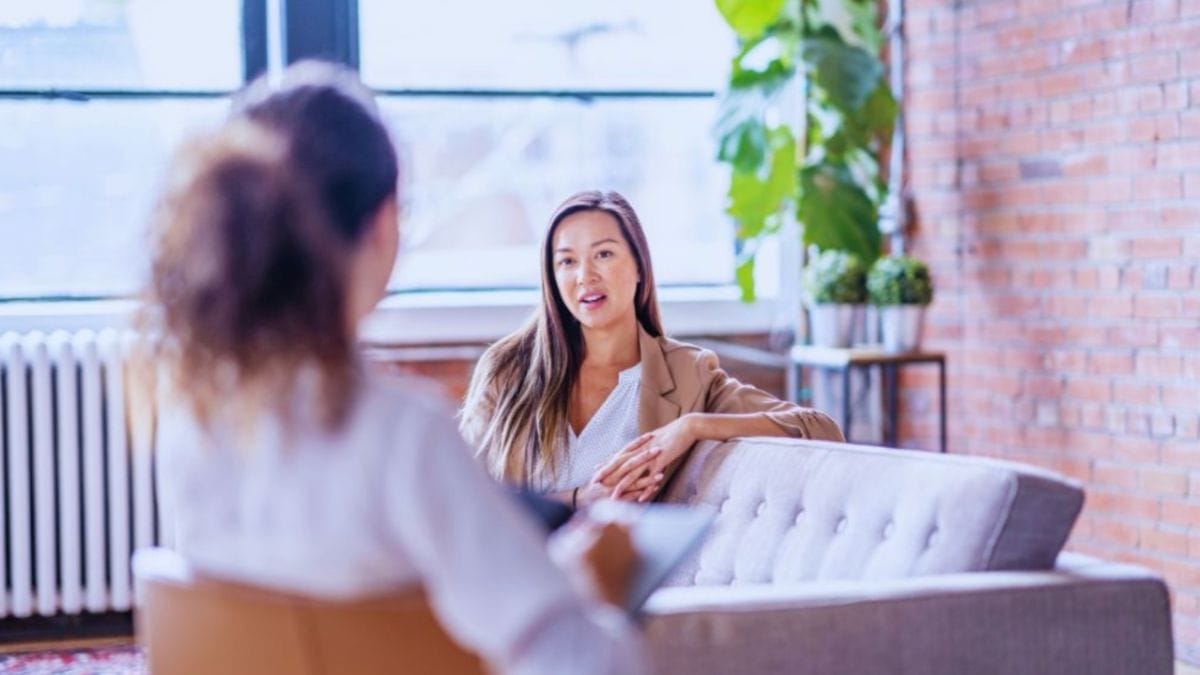 Mediumship in Temecula: What You Need to Know 1 Mediumship in Temecula consultation with a medium speaking to a client in a comfortable office setting.